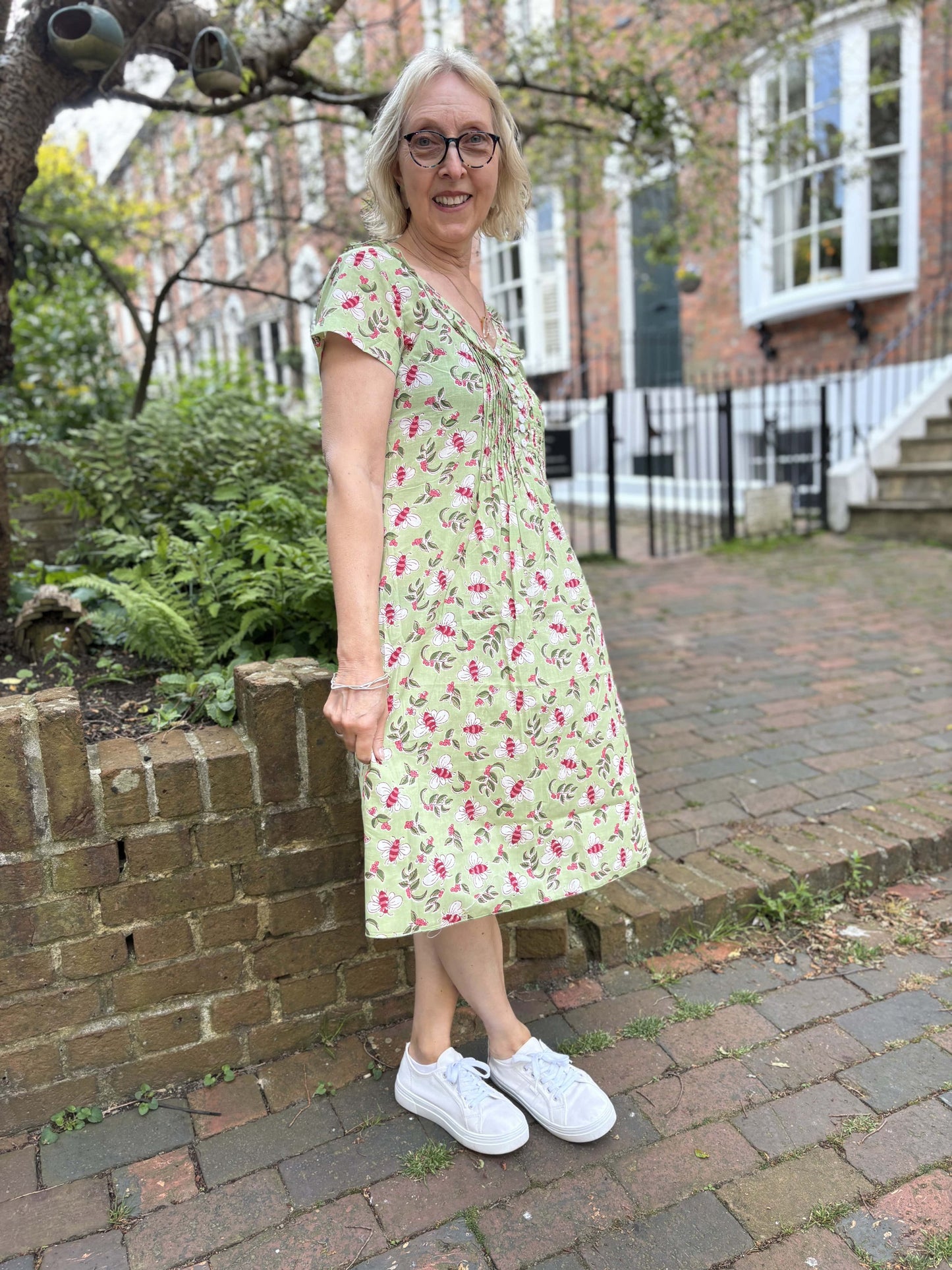 Cotton Karen Short Sleeve Day Dress in Pistachio with Pink Busy Bees by At Last London