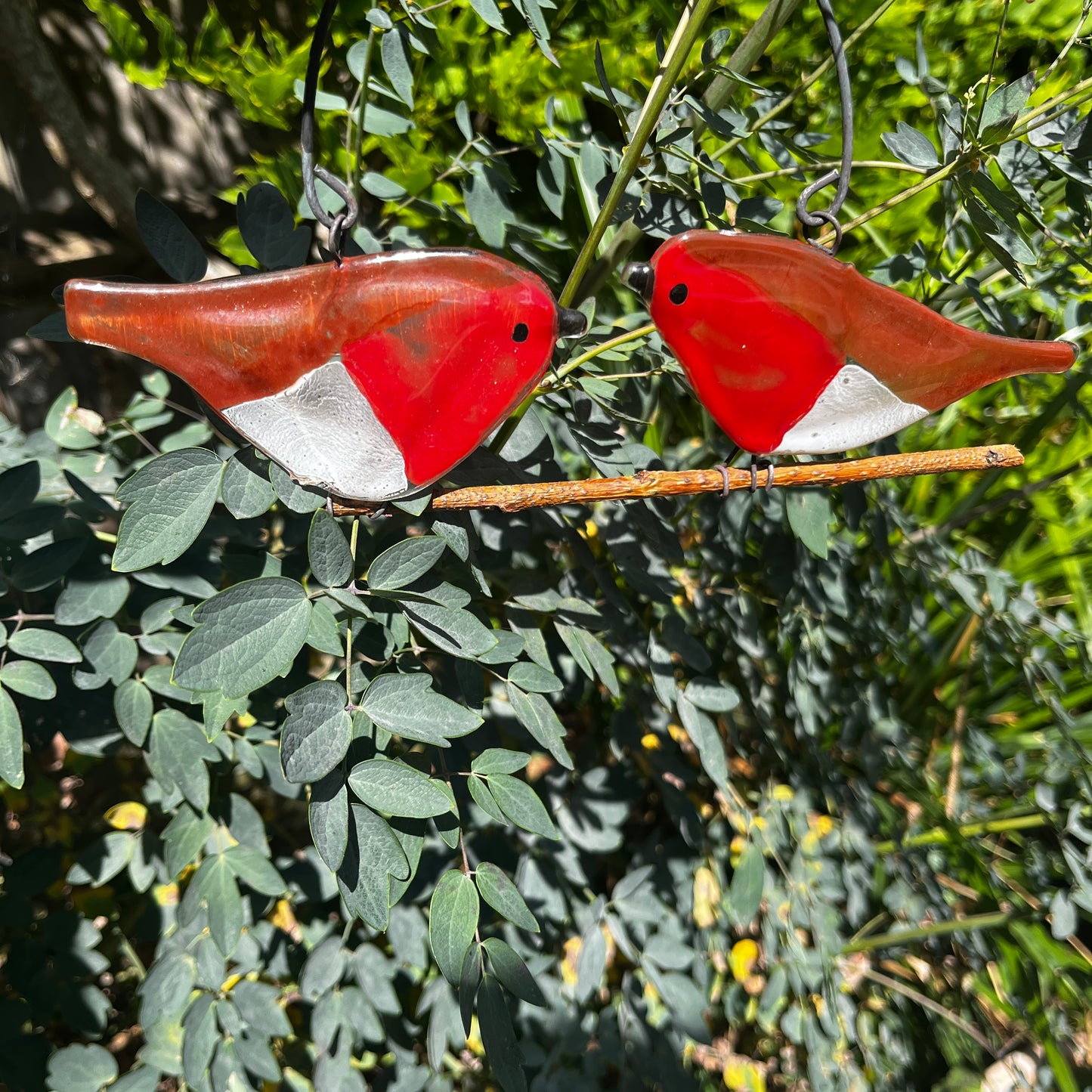 Two Glass Birds on a Branch