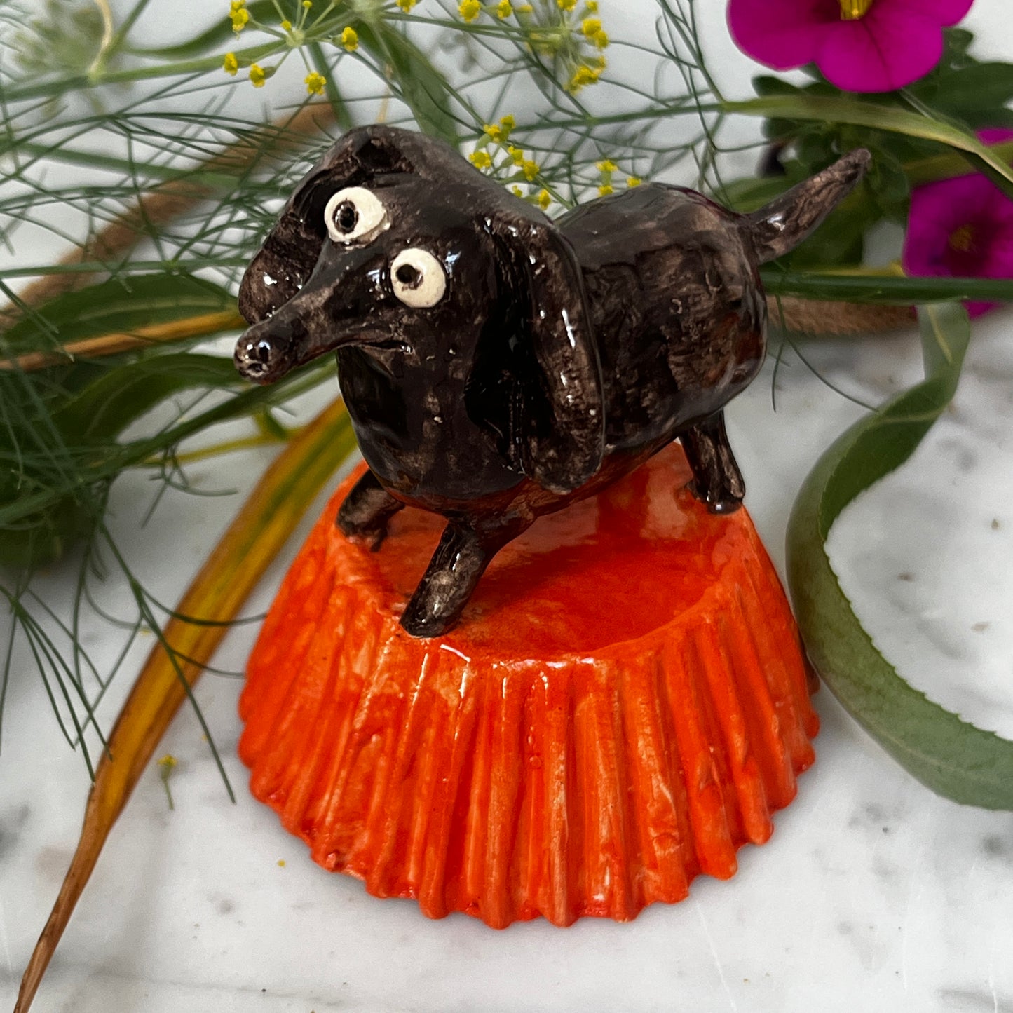 Little Brown Dog on Orange Stand