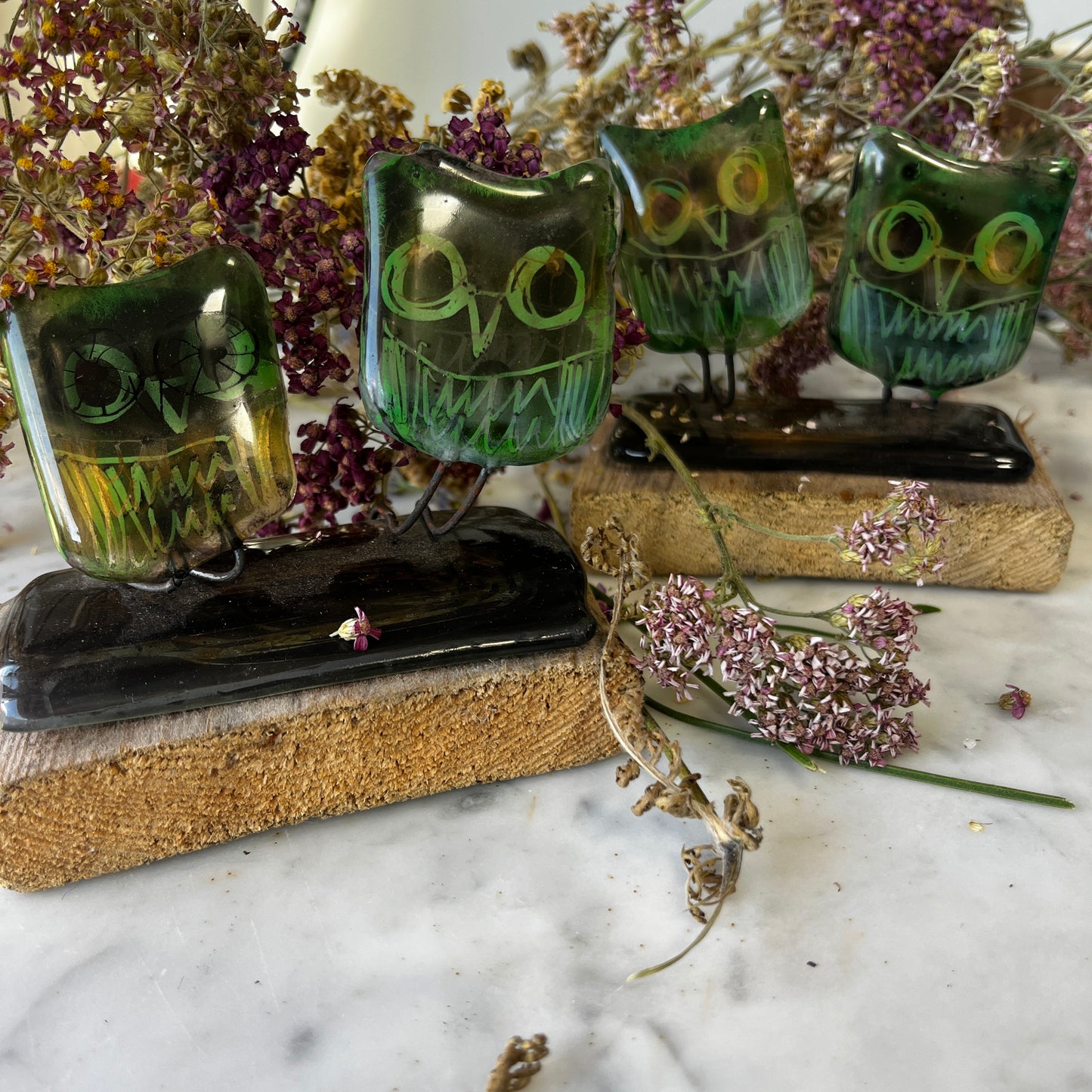 Two Glass Owls on Wooden Stand