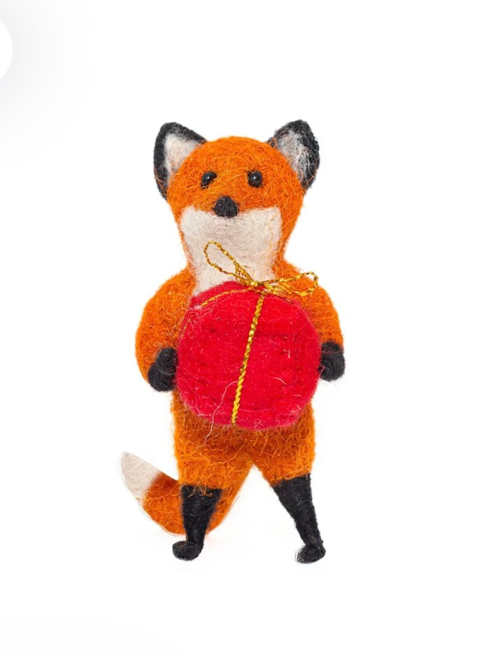 Rusty Fox Holding a Present