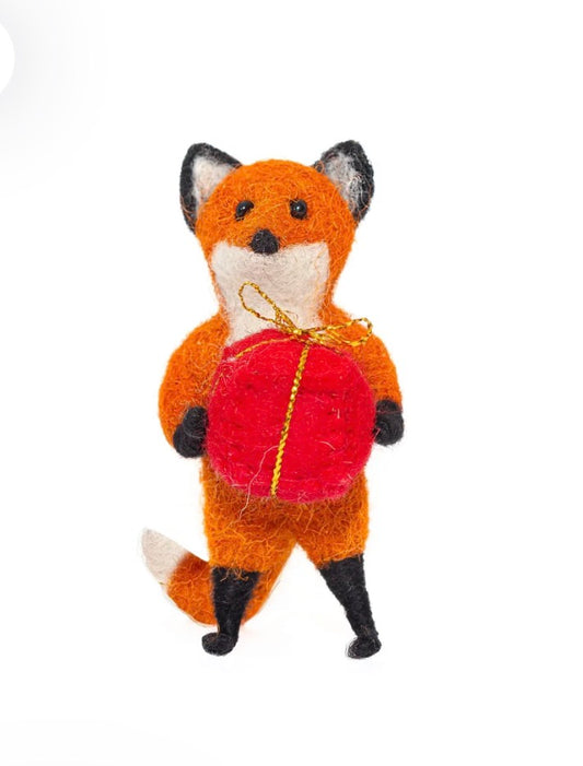 Rusty Fox Holding a Present