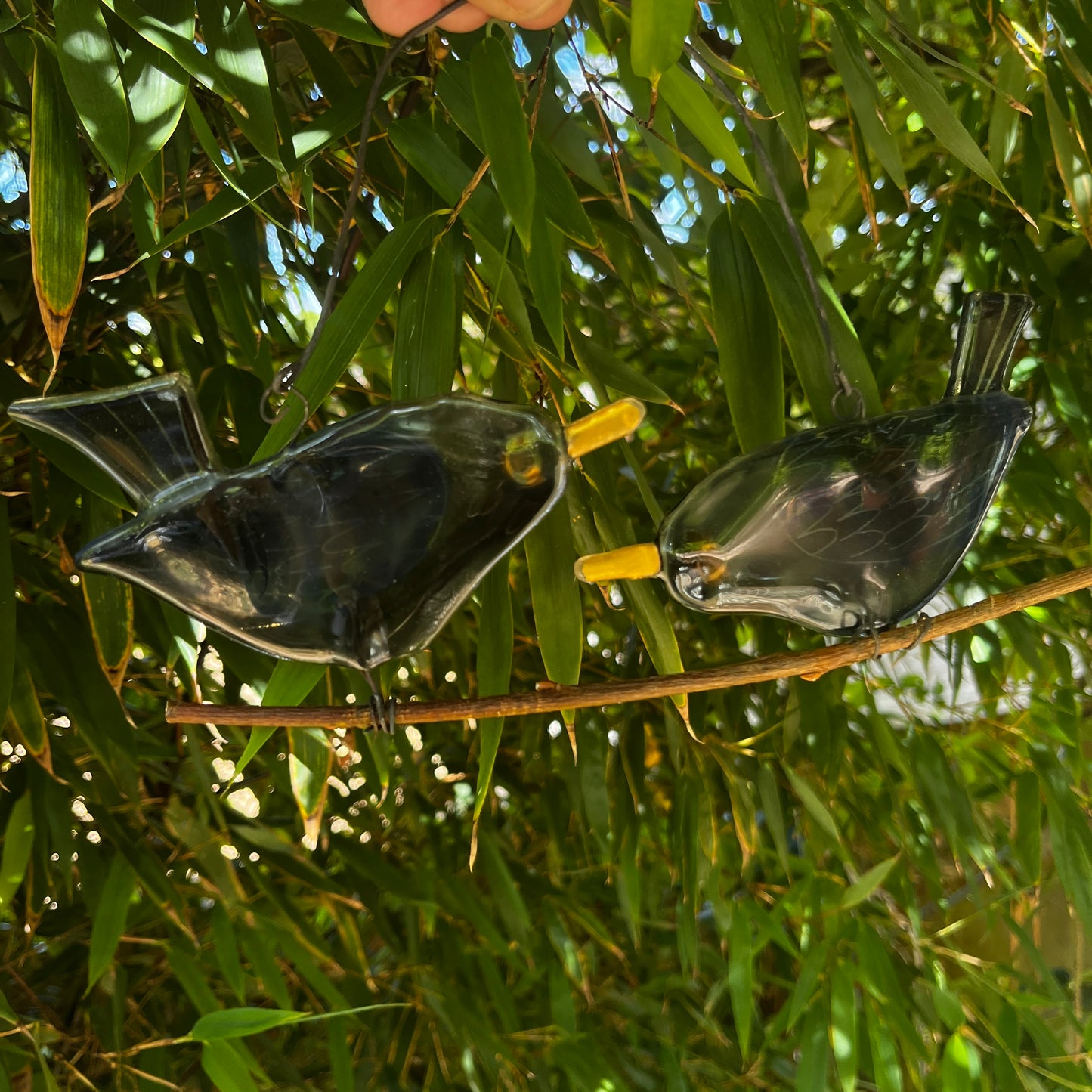 Two Glass Birds on a Branch