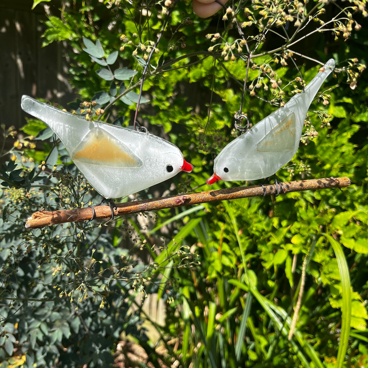 Two Glass Birds on a Branch