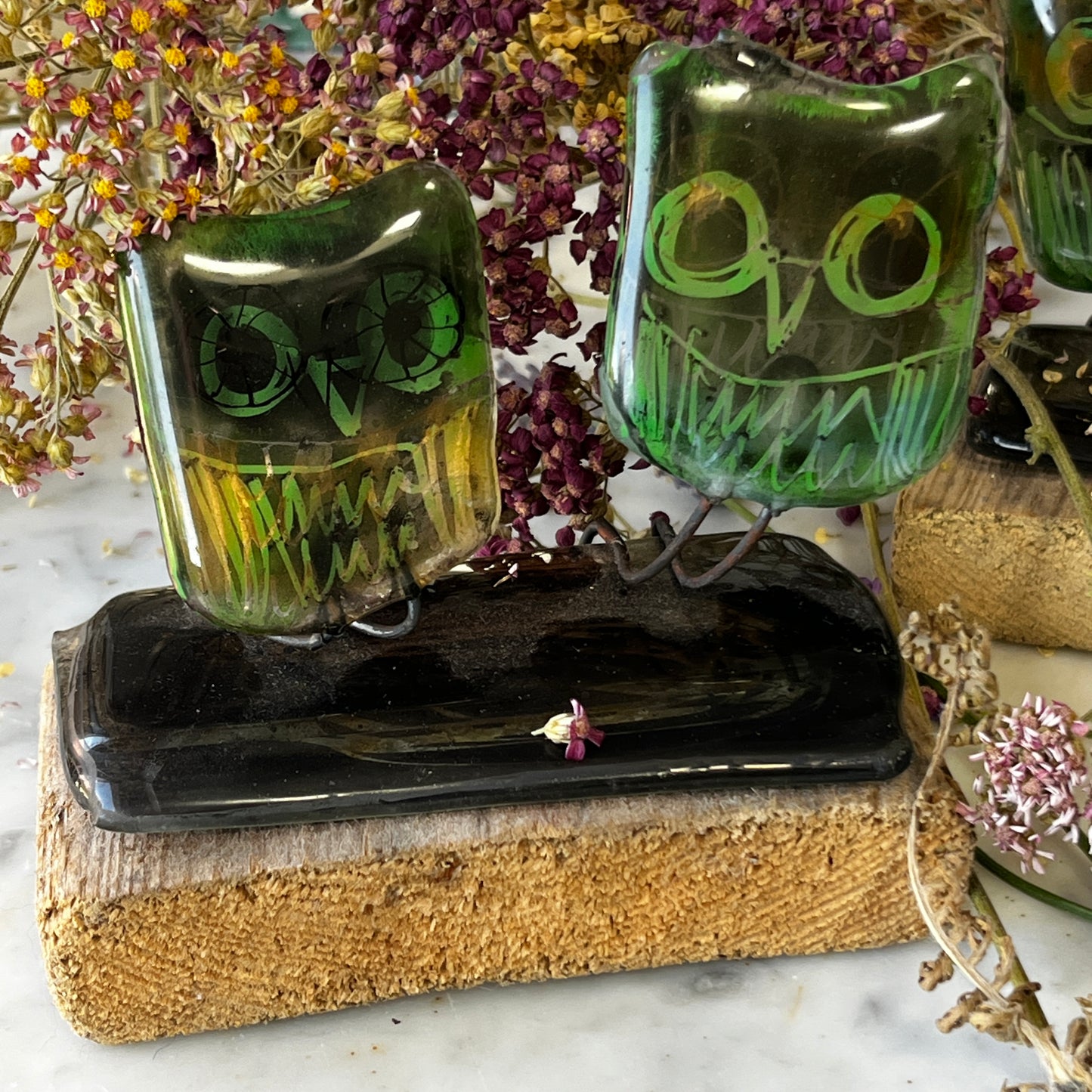 Two Glass Owls on Wooden Stand