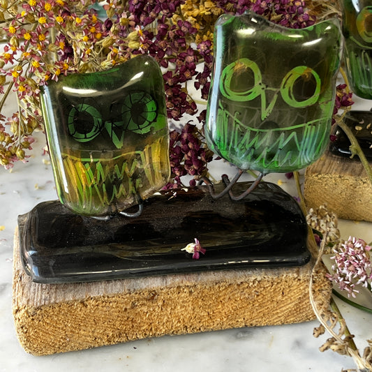 Two Glass Owls on Wooden Stand