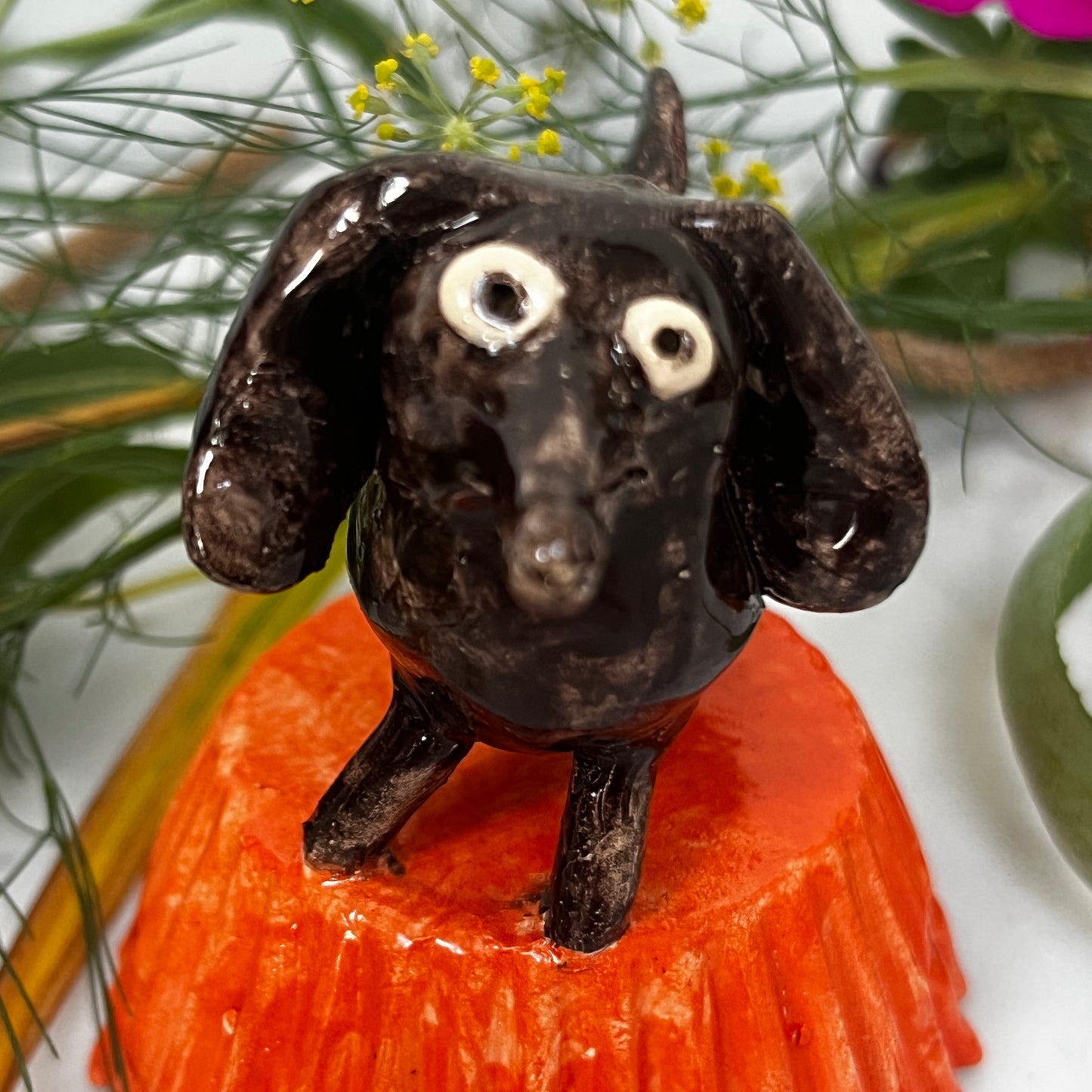 Little Brown Dog on Orange Stand